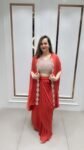 Beautiful Top with Drape Saree Style Skirt And Shrug In Rich Coral Shade