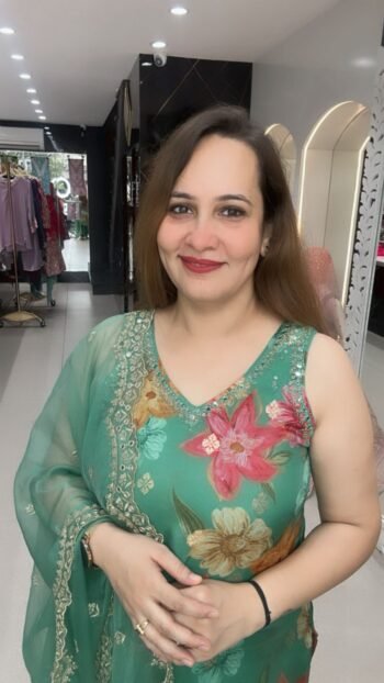 A sleeveless three piece set  V-neck top adorned with colorful floral embroidery.