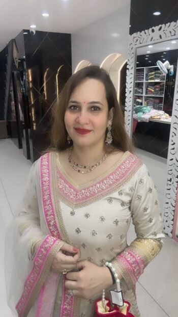 A three piece set in pure dola silk with intricate handwork and detailing