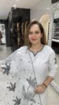 A white kurti and pant set in modal silk with a matching organza duppata