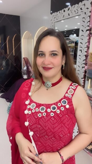 A vibrant red Georgette kurti set with intricate mirror work