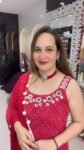 A vibrant red Georgette kurti set with intricate mirror work